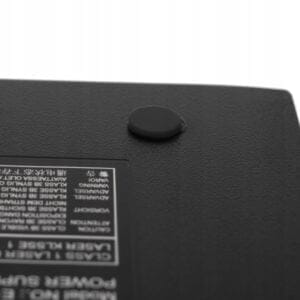 a black rectangular object with a round black button