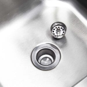 a sink drain with a hole in it