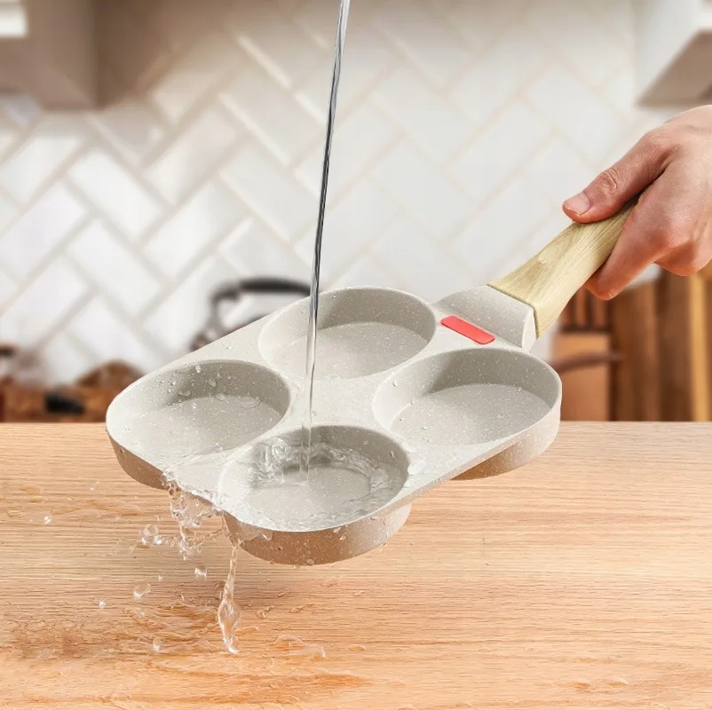 a hand pouring water into a muffin pan