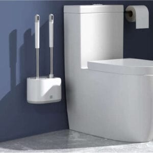 a toilet and toilet brush holder
